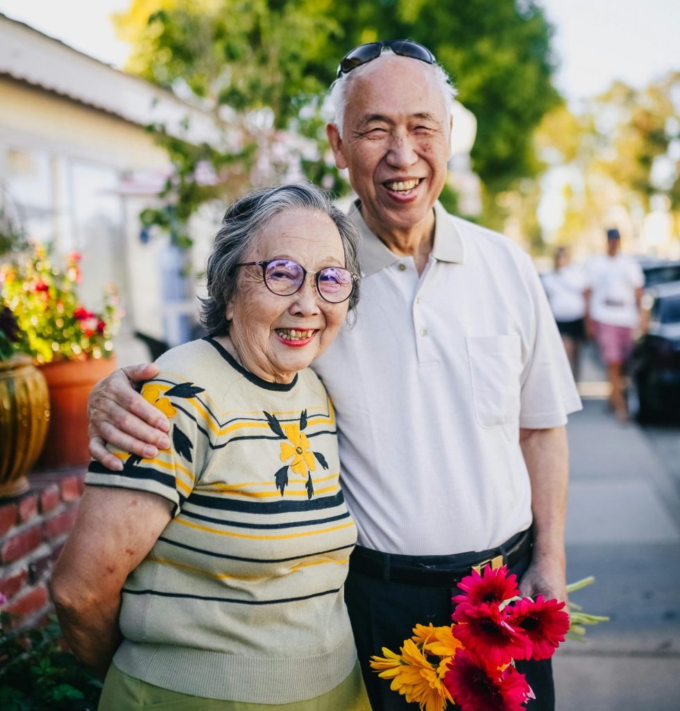 Older couple standing side by side