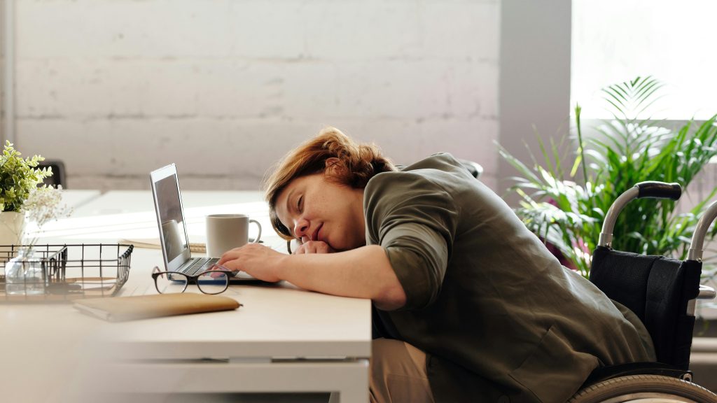 Woman sleeping at desk