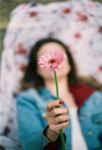 Woman holding flower