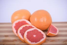 "Grapefruit" by ExplorerBob is licensed under CC0 Photo of sliced grapefruit